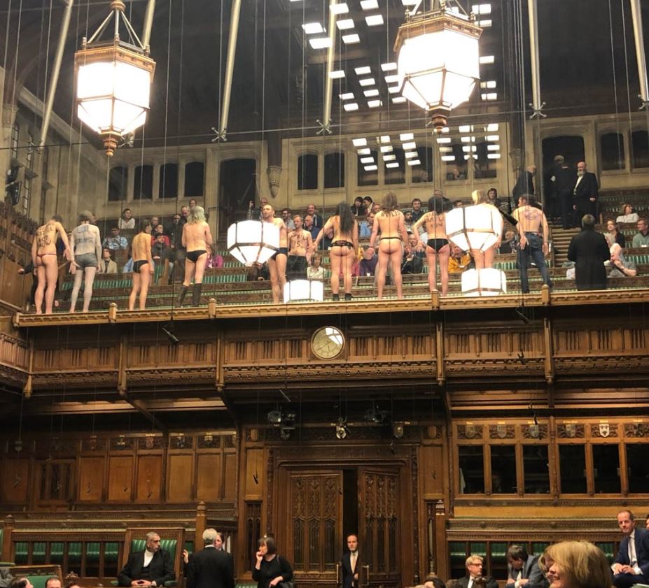  12 eco protesters who were in the public gallery took their clothes off as MPs stopped to watch