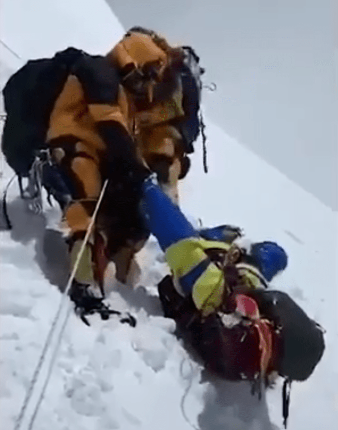  Climber Anjali Sharad Kulkarni, 51, struggles as the Sherpas try to help her