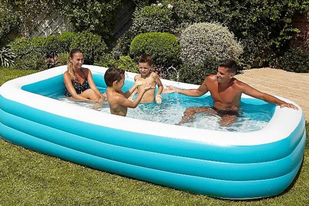 Family in a swimming pool in their garden