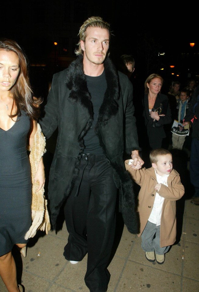 David spotted in London with Brooklyn in 2002 dressed in black and wearing a hairband