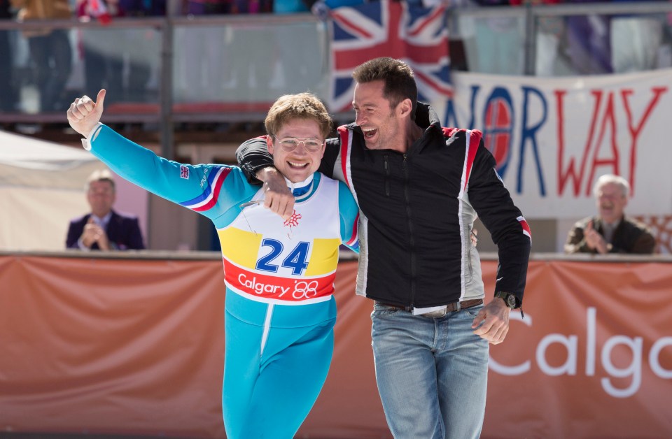  Taron Egerton in Eddie The Eagle with Hugh Jackman