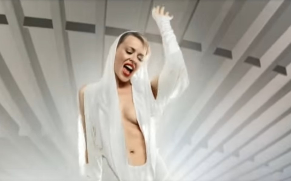  Wowing her admirers – especially the boys – in a white catsuit with a daring, plunging neckline, Kylie is in full raunch mode in the video for her 2001 single Can’t Get You Out Of My Head