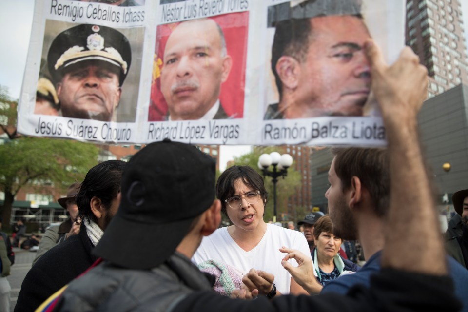  A supporter of Maduro, centre, argues with supporters of Guaido during a rally in New York's Union Square