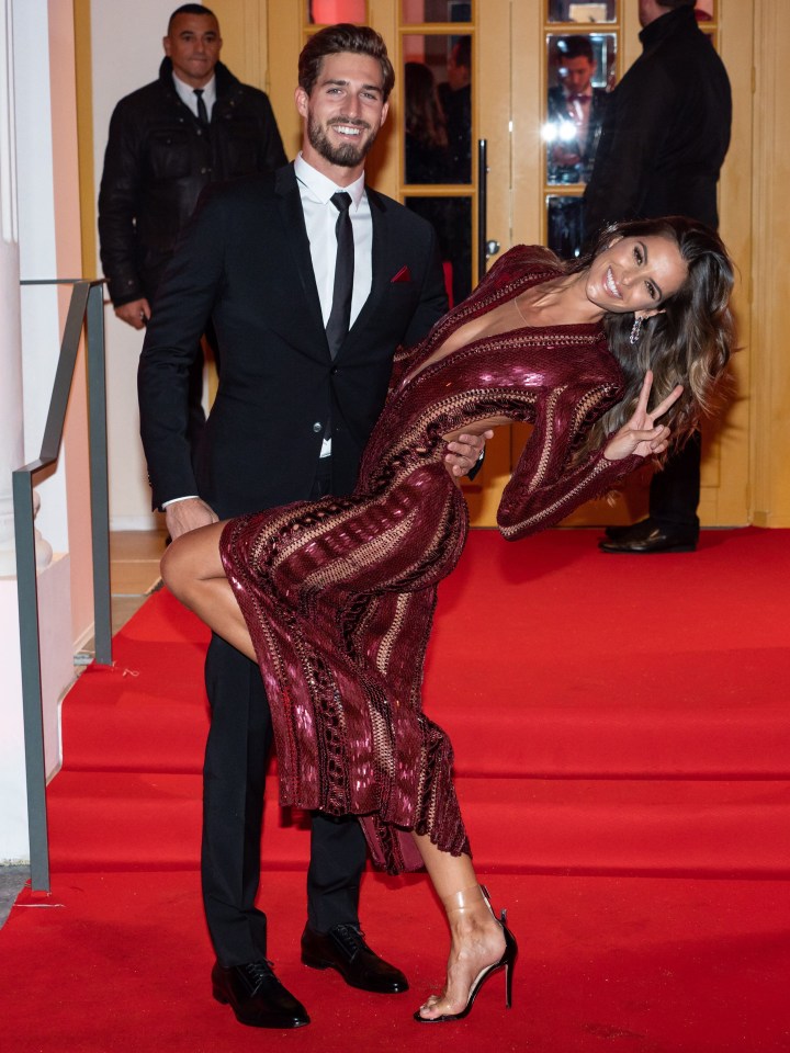 Eintracht Frankfurt goalie Kevin and fiancee Izabel throw some shapes on the red carpet