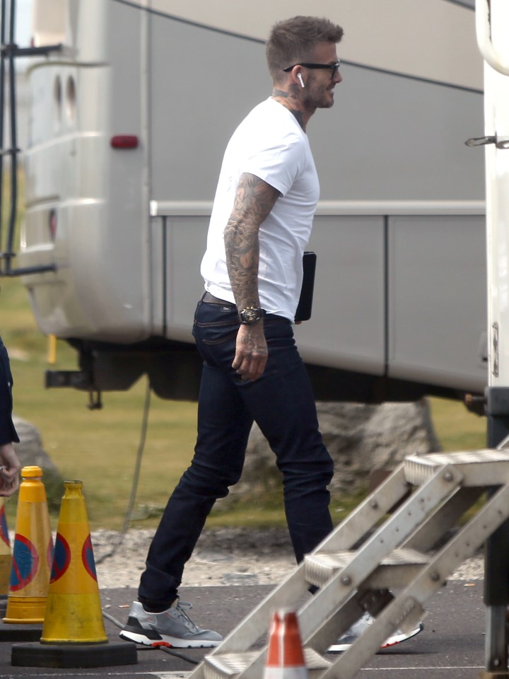 David went for a more casual look behind the scenes as he paired a white T-shirt with a pair of trainers