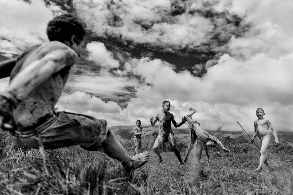  As part of Baliem Valley Festival, tribal village people perform their playing process in Indonesia