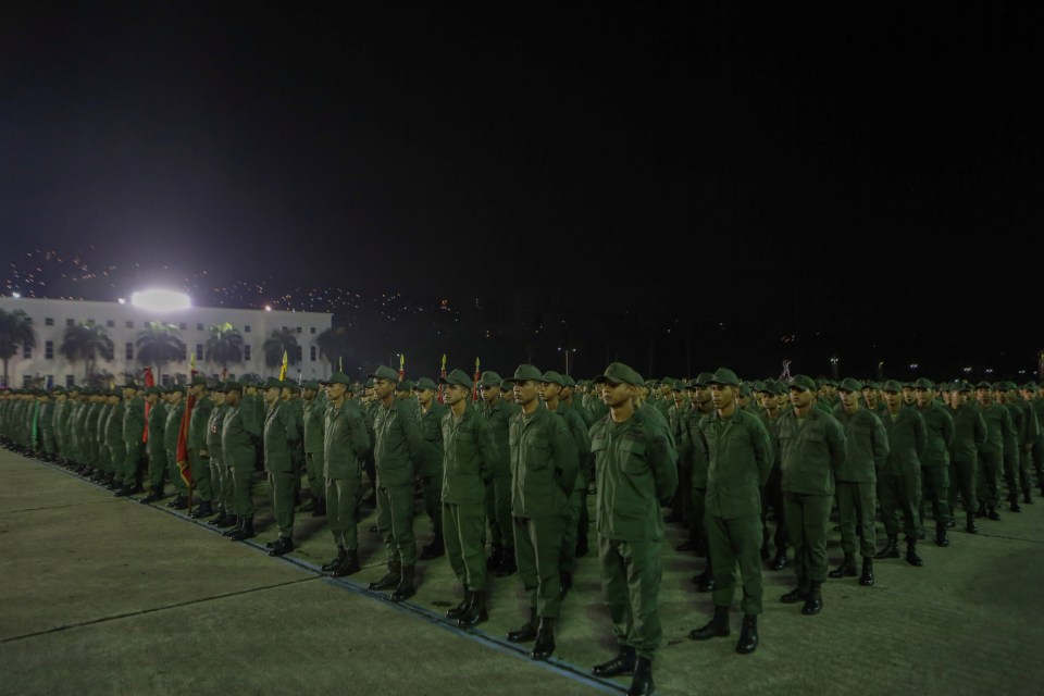  Soldiers take part in a ceremony with Venezuela's President Nicolas Maduro at a military base in Caracas following last week's failed coup