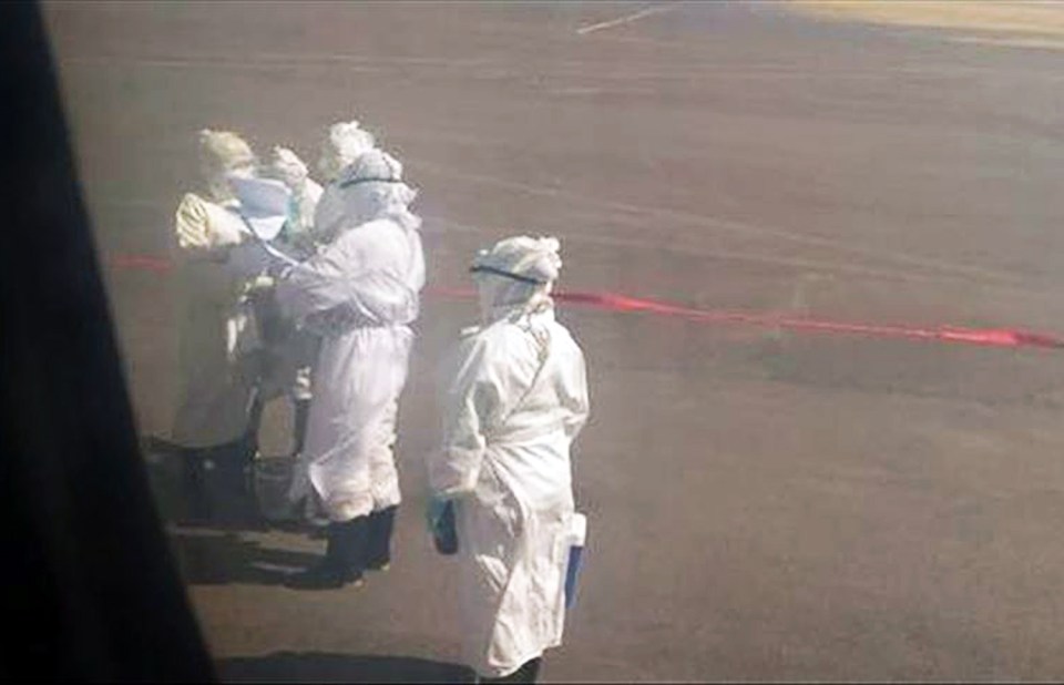  Medics can be seen waiting on the runway