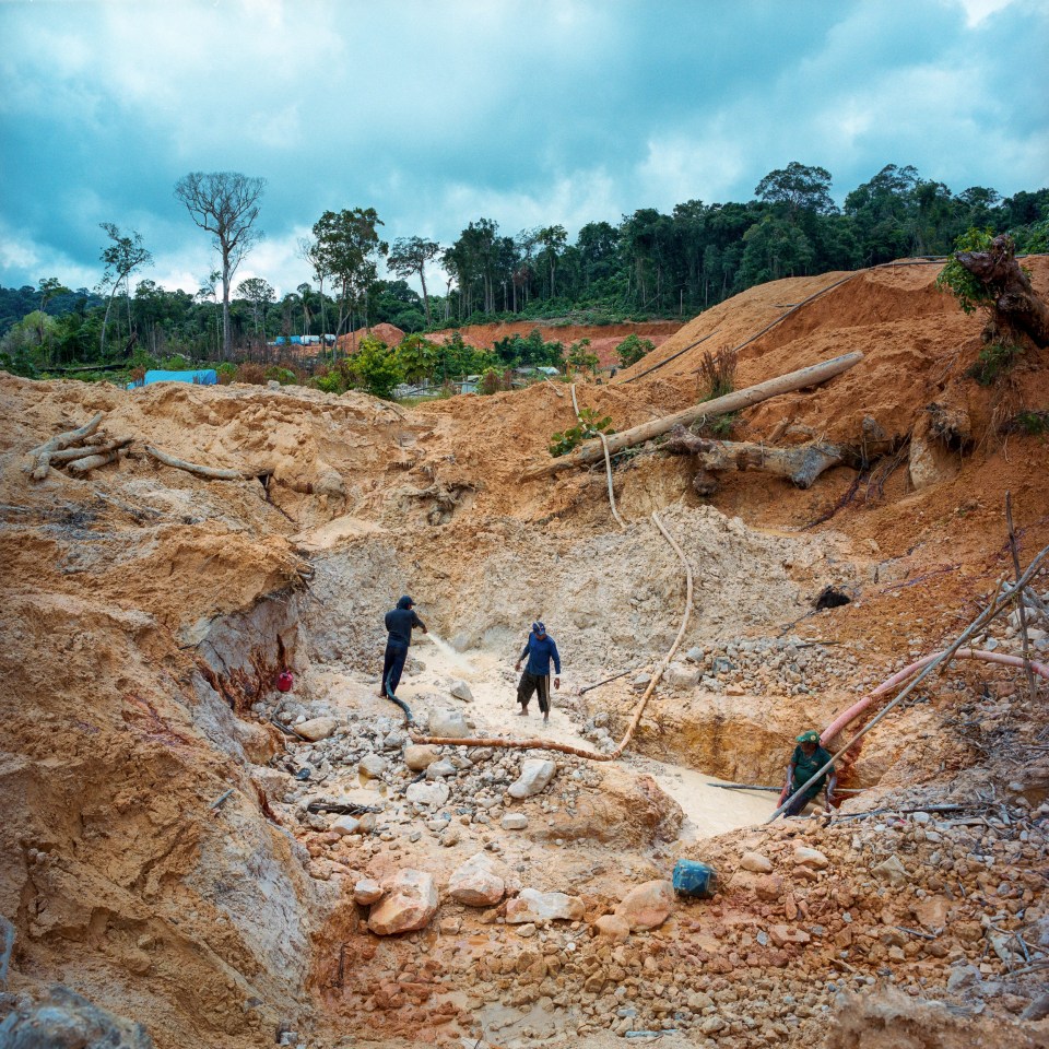  Workers assess the area to build the dam