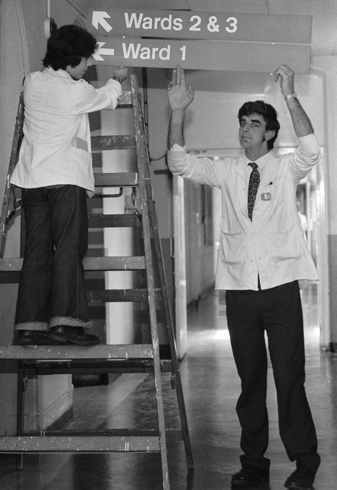  Peter Mayhew helps put up signs to the wards at King's College Hospital, where he worked as an orderly