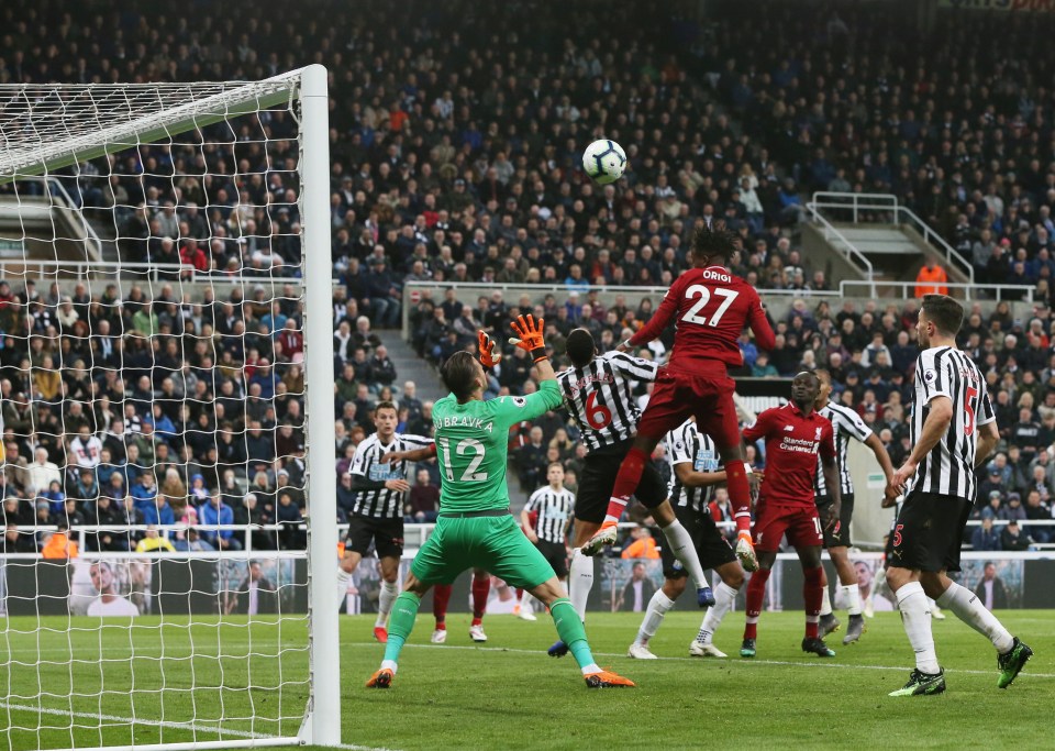  Divock Origi headed home a vital winner as Liverpool beat Newcastle 3-2 to keep their Premier League title hopes alive