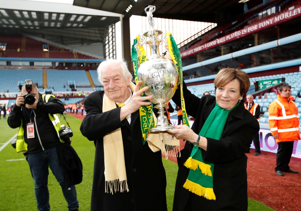  Norwich majority shareholders Delia Smith and Michael Wynn Jones hold the trophy