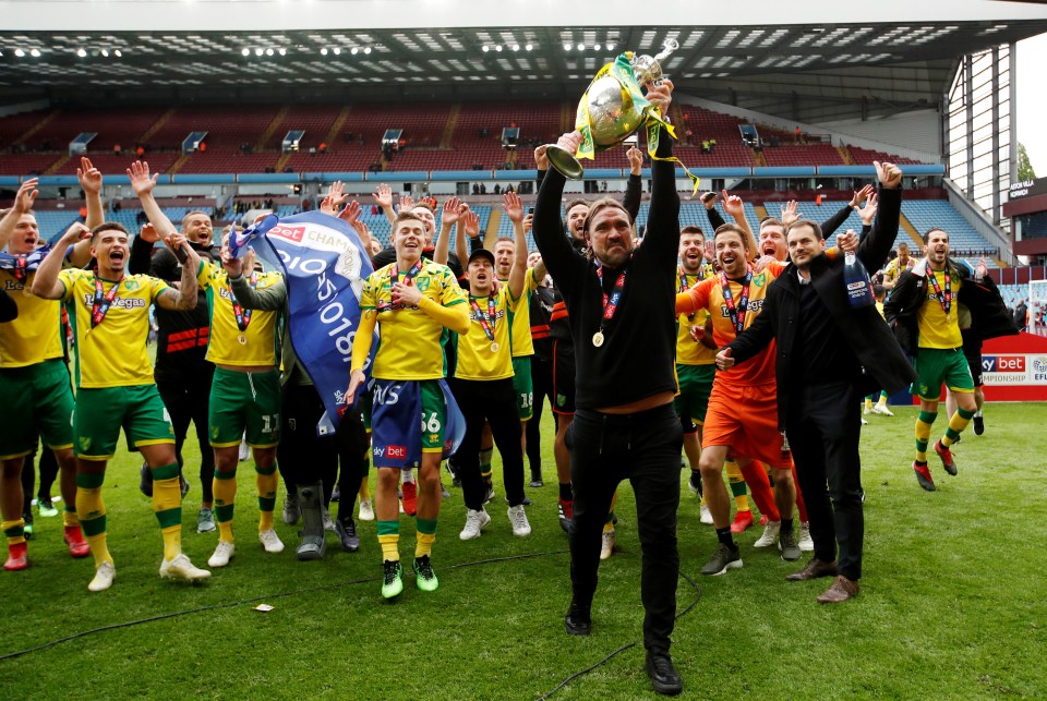  Norwich coach Daniel Farke lifts the trophy after the 2-1 victory over Villa