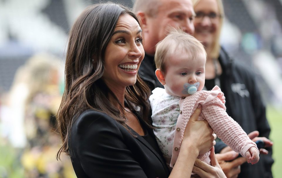  The seven-month-old graced the pitch with her dummy firmly in place as her famous parents showed her off to their pals