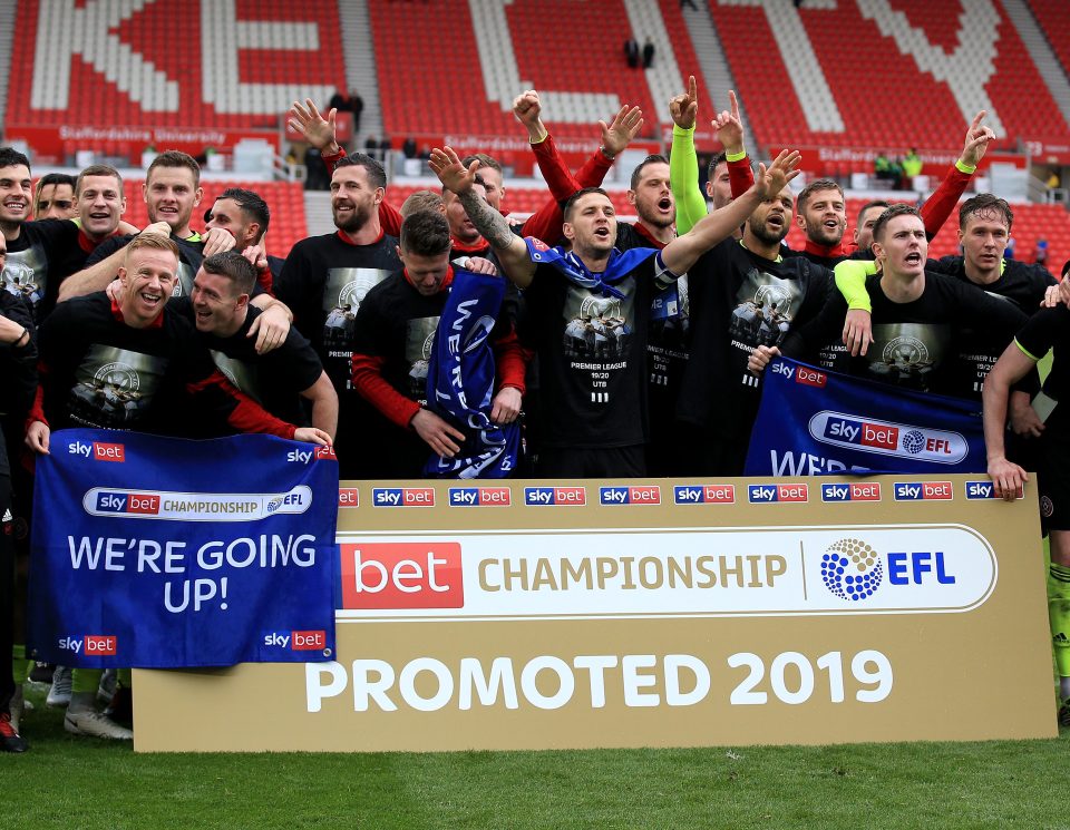  Sheffield United skipper Billy Sharp, fourth left, leads rejoicing at promotion