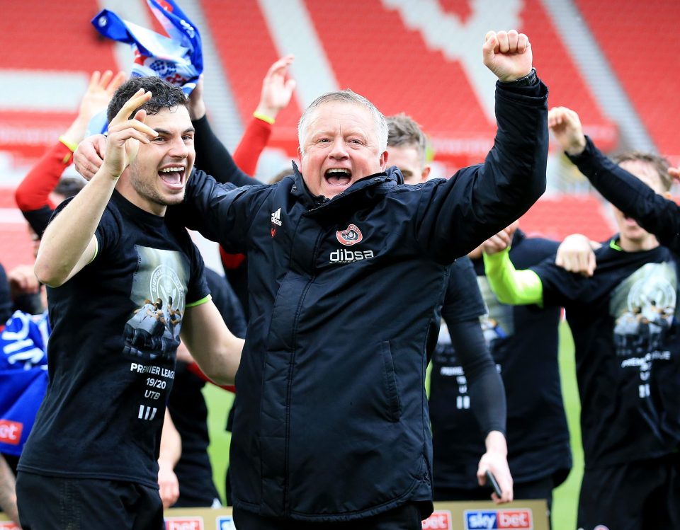  Sheffield United boss Chris Wilder celebrates promotion - with runners-up spot to Norwich in the Championship after a 2-2 draw at Stoke