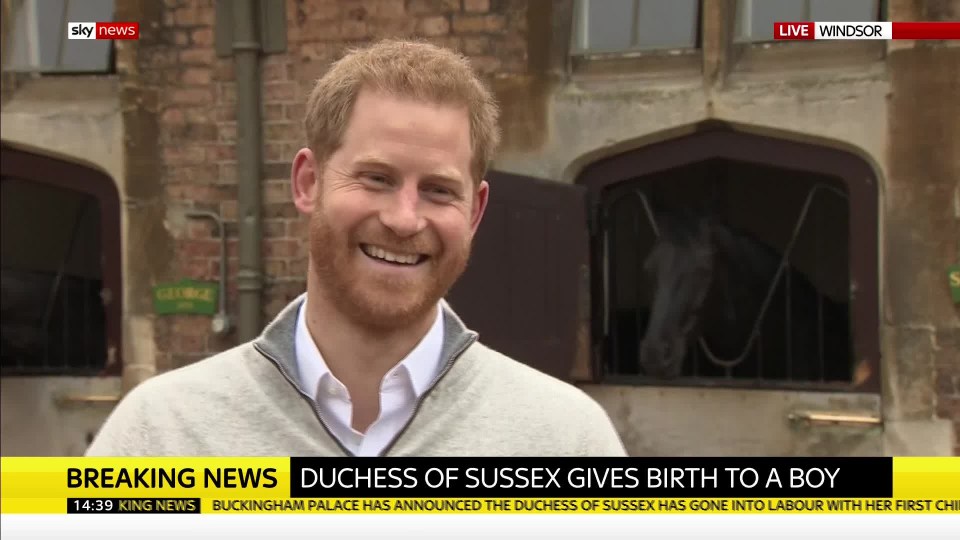 Prince Harry looks delighted as he speaks to the press about Meghan Markle and his first son