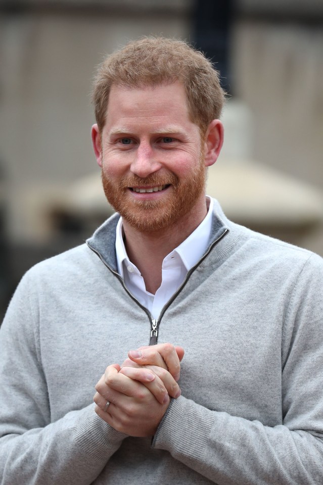 A delighted Prince Harry beams for the camera as he announces the birth of his son