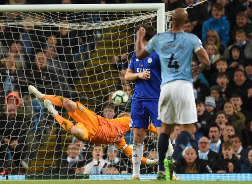  Kompany's incredible goal against Leicester virtually sealed the title for Man City