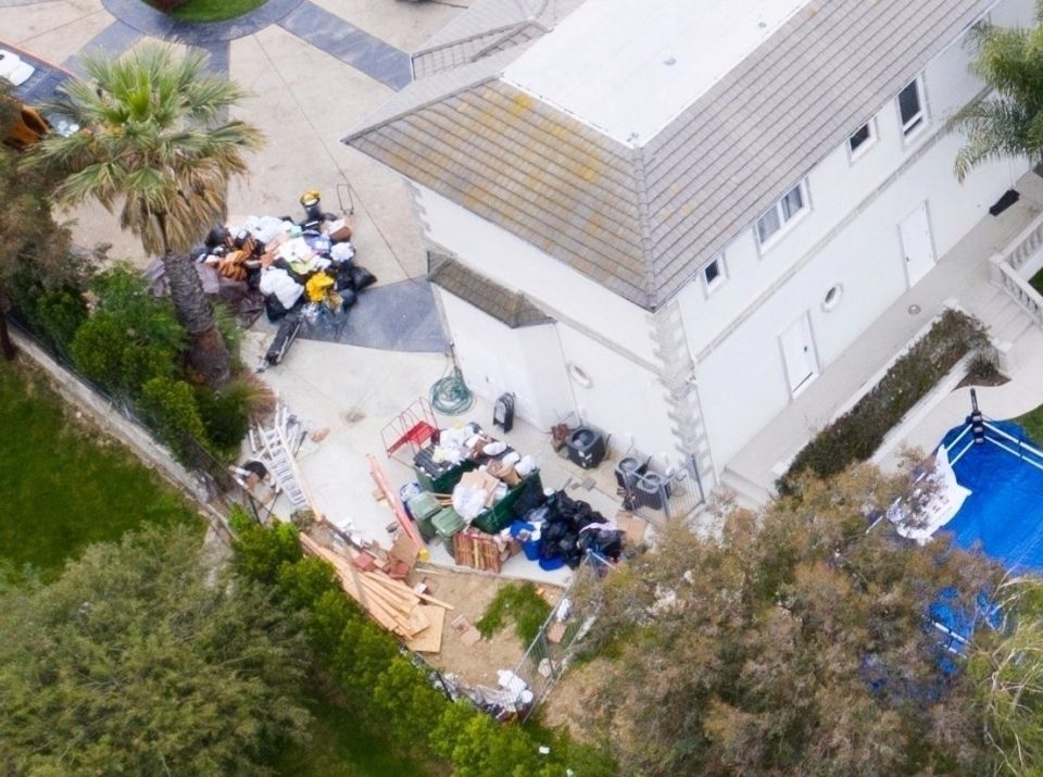  Huge piles of rubbish were seen outside the mansion the following day