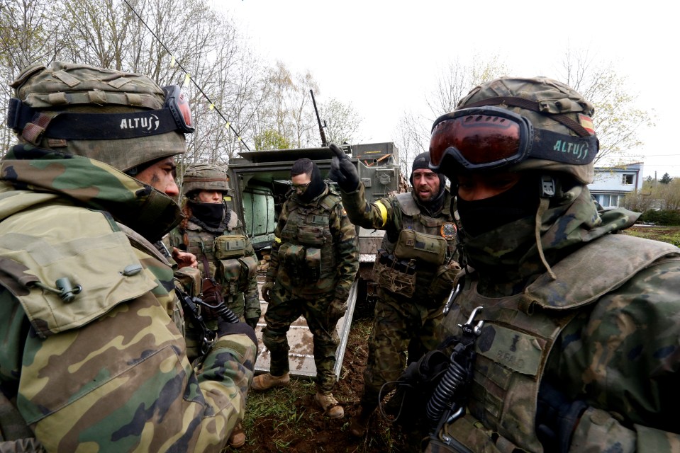 Spanish soldiers take part in a drill near Sillarmae in Estonia