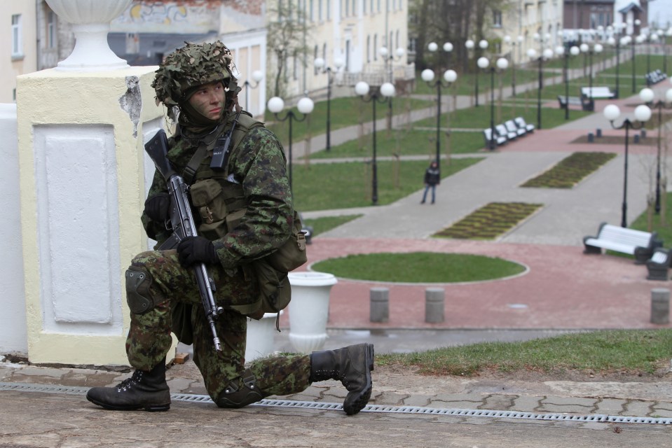 An Estonian soldier keeps watch in Sillamae