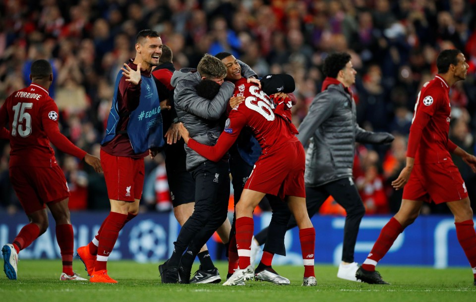  Liverpool players celebrating at Anfield last night