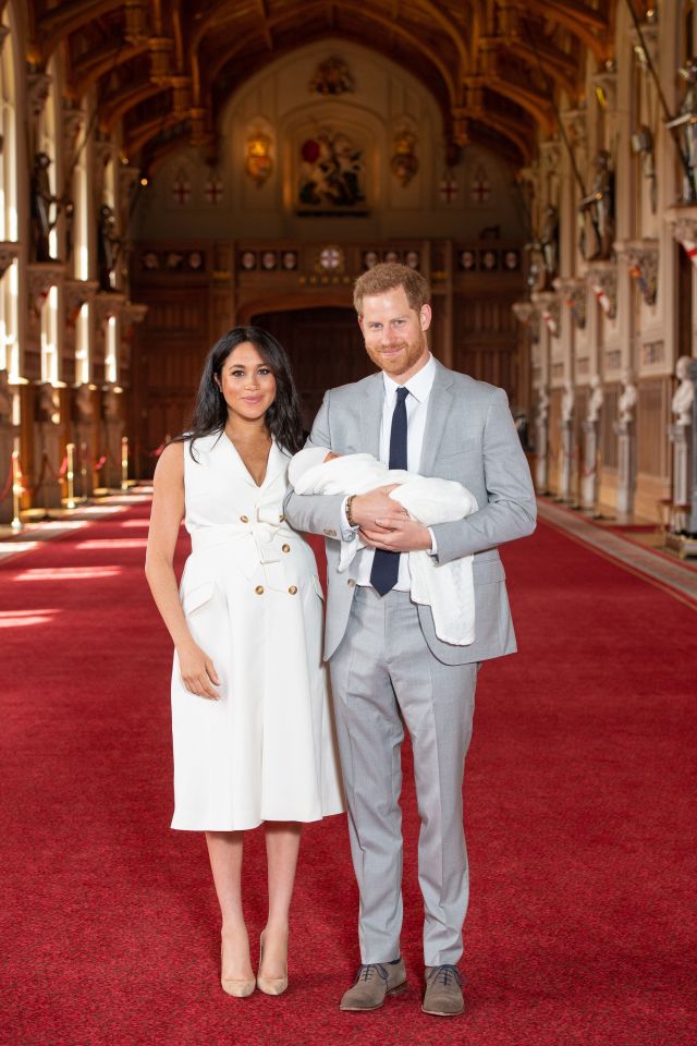  The proud parents pose with their little boy