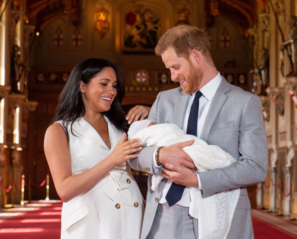  New mum Meghan Markle said 'I have the two best guys in the world' as she put a hand on her little boy