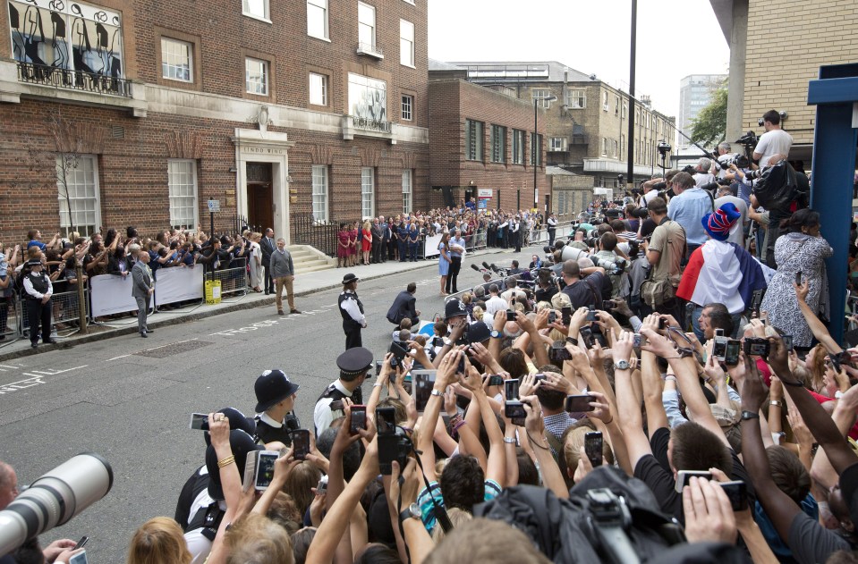  The world's media was trained on Prince William and Kate Middleton as they welcomed their three babies into the world