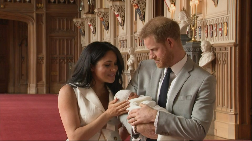  Prince Harry looks lovingly at his little boy