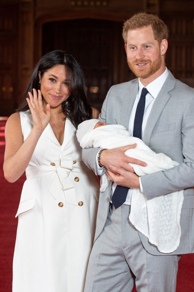 Meghan wore this sleeveless white tailored dress for her first photocall with baby Archie