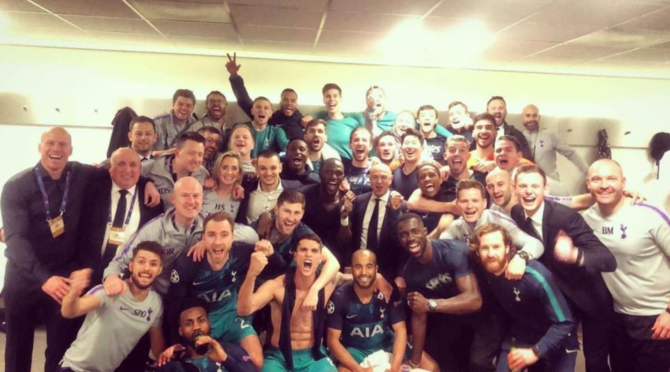  Tottenham stars and club staff pose for a group photo after historic Champions League win