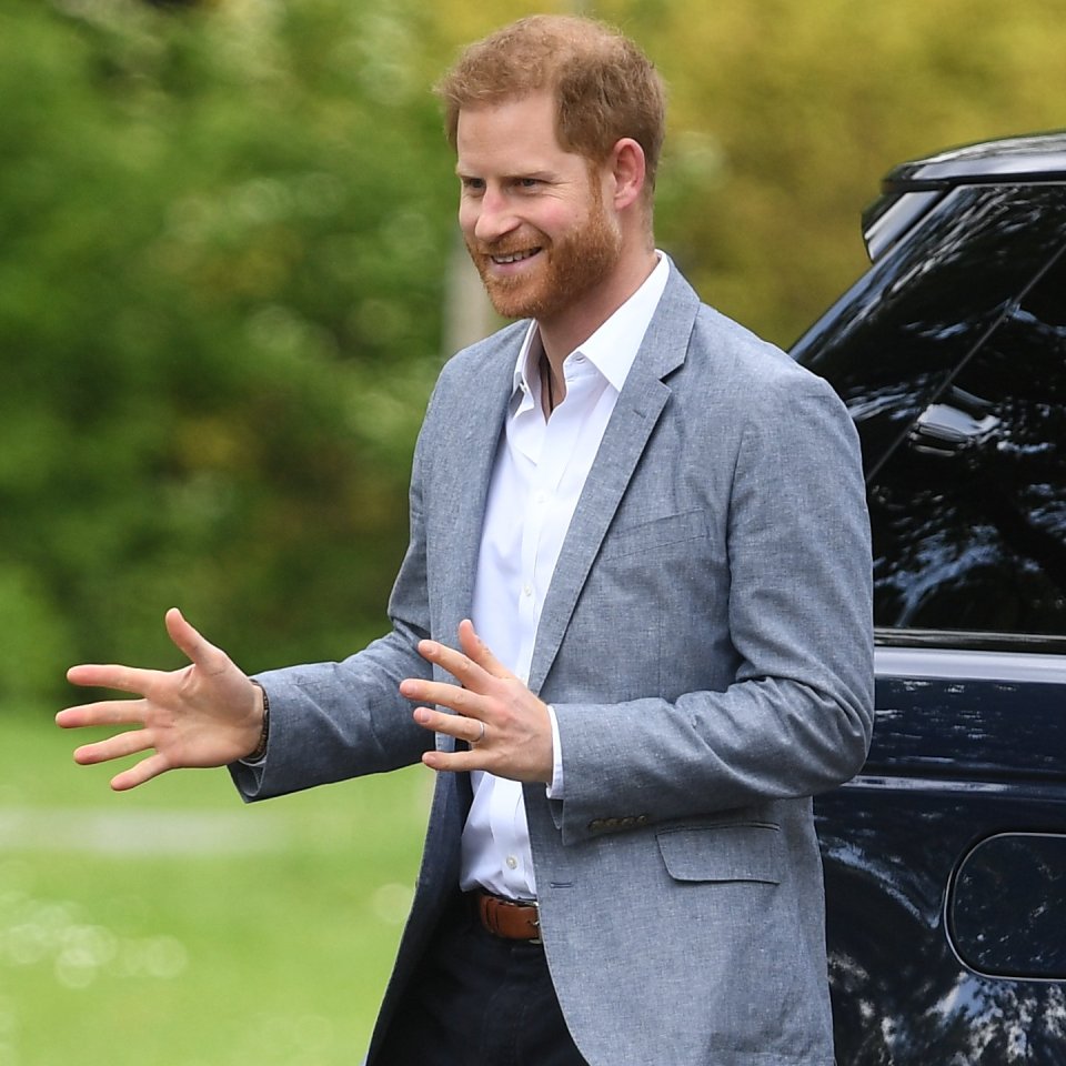  New dad Prince Harry couldn't stop smiling as he arrived in the Netherlands today