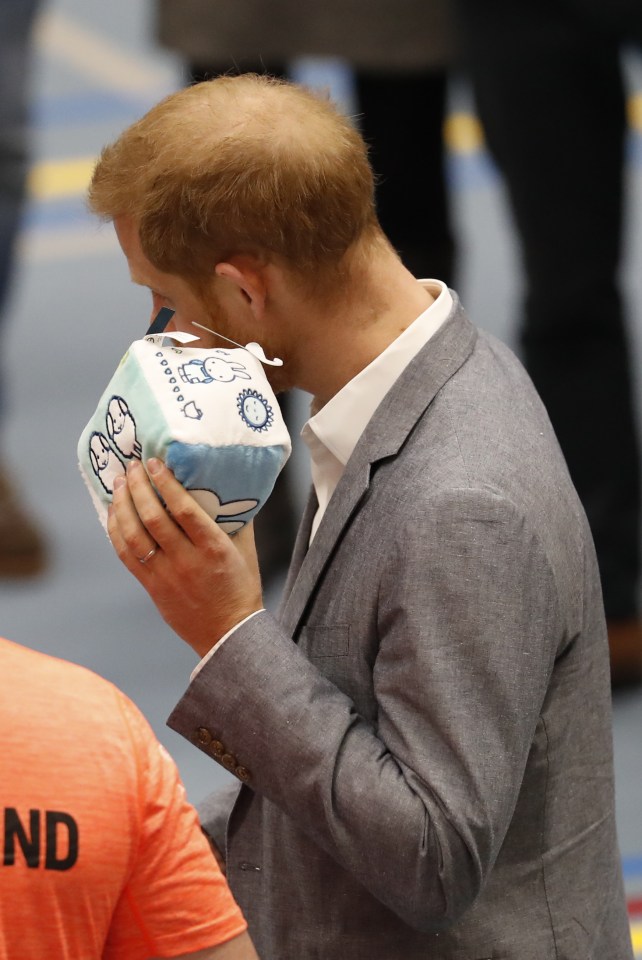  Prince Harry was given a blue baby toy during his visit to the Hague today