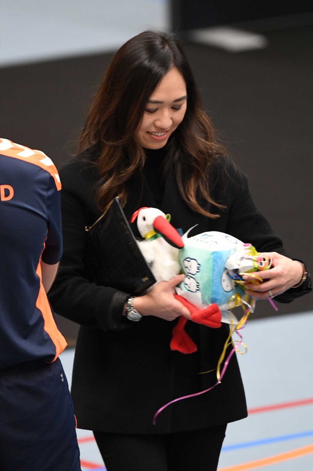  Prince Harry's aide holds some of the baby gifts he was given today