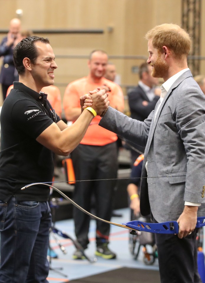  Prince Harry was given a handshake after hitting the target