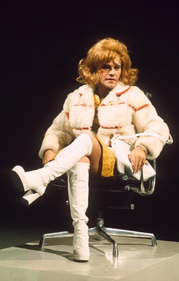  Freddie Starr dressed in a dress and high boots during one of his gags for Who Do You Do