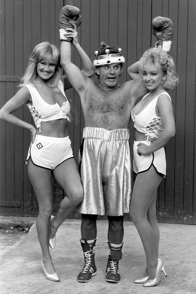  Freddie Starr poses as a boxer in his heyday flanked by two models