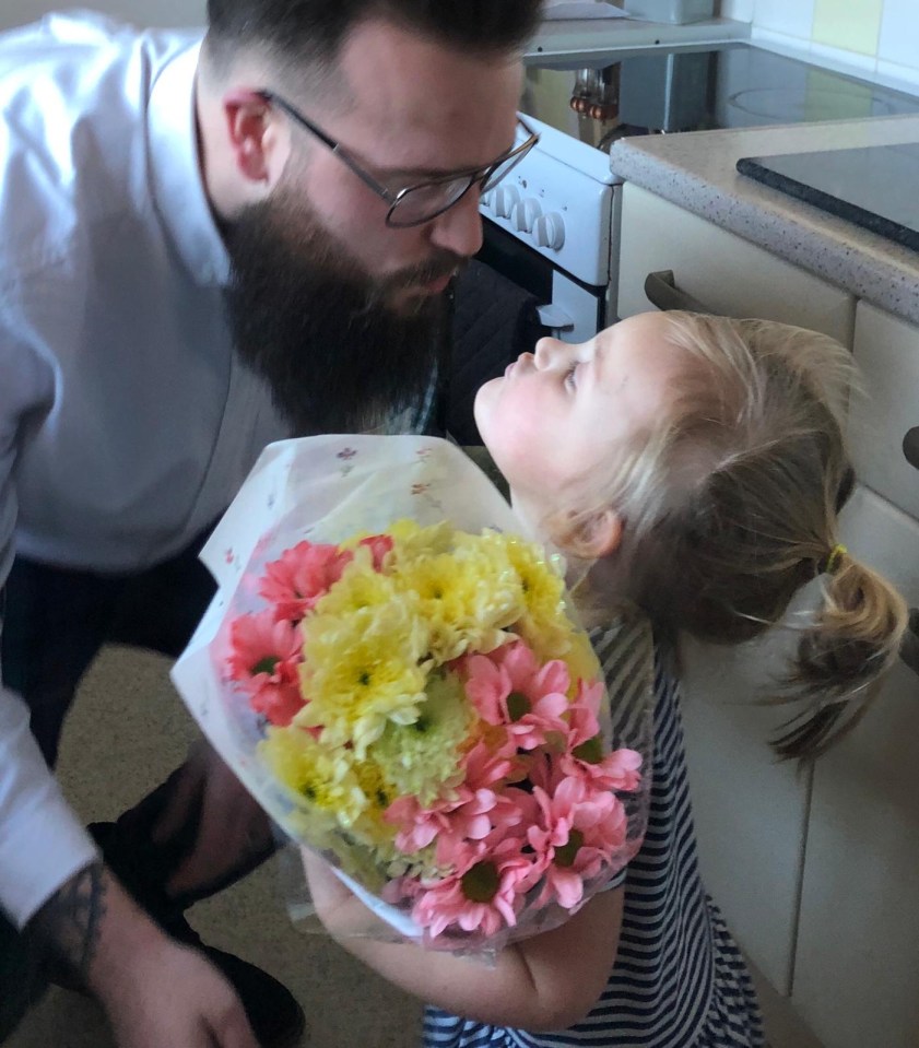 Ken gives three-year-old daughter Aydaline a kiss