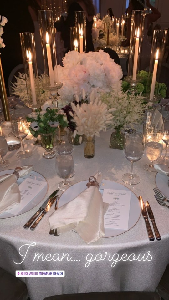  The couple's tables were decorated with flowers and silk napkins