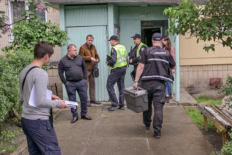 Police outside the couple’s home in Ukraine