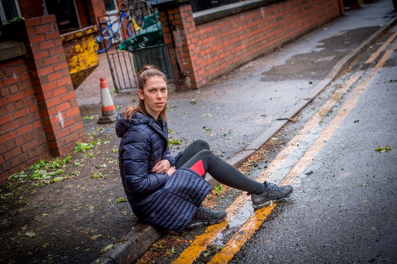 Mum Casey Taylor outside the family home in Salford