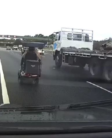  At one point, the scooter came dangerously close to a large lorry