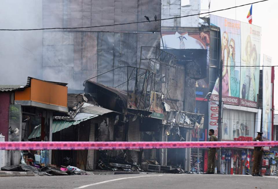  The smouldering ruins of businesses in Minuwangoda