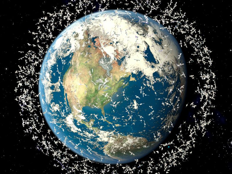 Space junk threatens to clog up Earth’s orbit (artist’s impression)