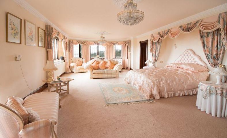 It boasts four bedrooms, including one master suite with a dressing room