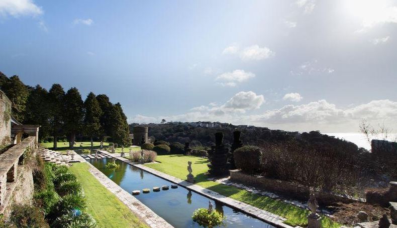 Large structured ponds cut through the perfect lawns