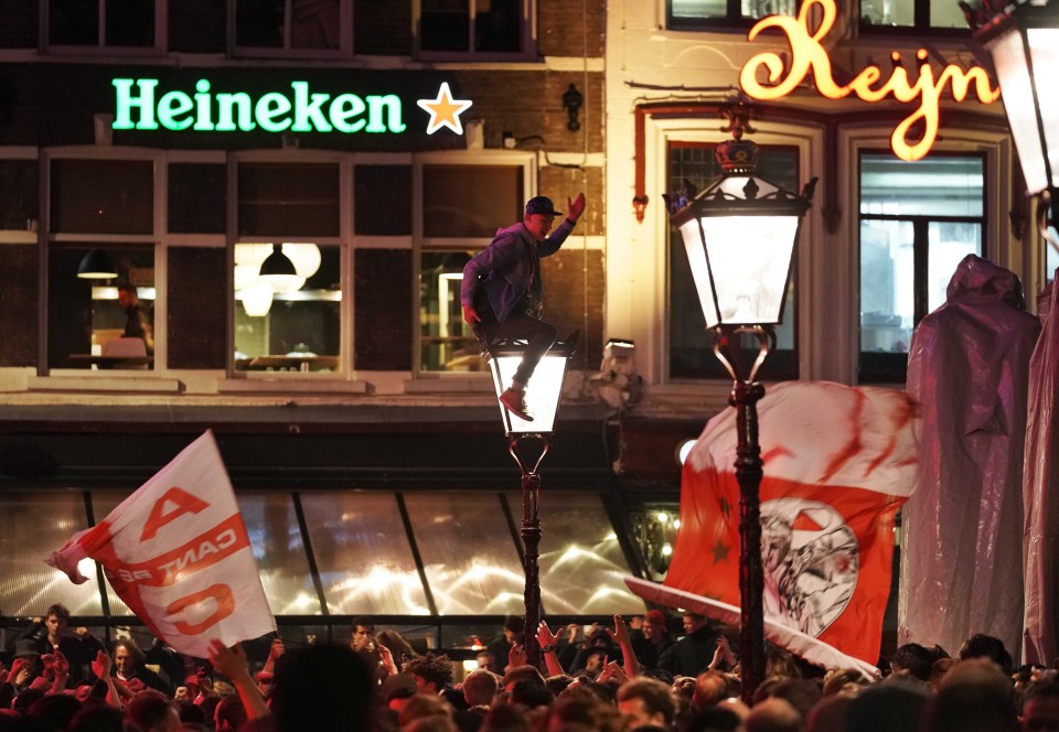  One fan was spotted climbing on a lamppost as he celebrated the win