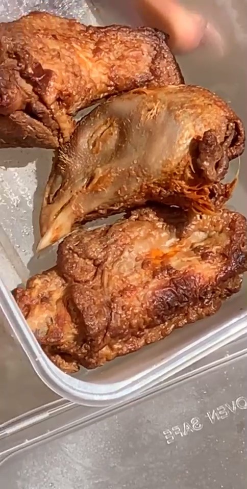 A mum-of-two was horrified when she discovered this severed chicken’s head in her wings